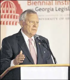  ?? JOHN ROARK / ATHENS BANNER-HERALD ?? Gov. Nathan Deal speaks at the biennial in Athens, where contenders for statewide office, from governor on down, met with backers in secluded conference rooms and latenight hot spots.