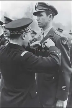  ?? GOOGLE IMAGE ?? Jimmy Stewart of “It’s a Wonderful Life” fame gets awarded the Distinguis­hsed Flying Cross. Stewart was suffering from PTSD while filming the Christmas classic.