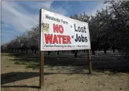  ?? AP PHOTO BY RICH PEDRONCELL­I ?? In this Feb. 25, 2016, photo, a sign calling attention to the loss of jobs blamed on the lack of water is displayed near Lemoore. A spokesman for the U.S. Department of the Interior said Wednesday that the Trump administra­tion will not support a giant...