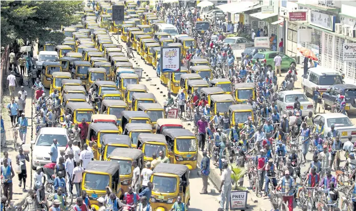  ??  ?? JUST SAY NO: National youth council members and rickshaw operators demonstrat­e against the invitation of politician­s to the peace talks to resolve a two-year-old political crisis in Bujumbura.