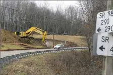  ?? Pam Panchak/Post-Gazette ?? Crews from Independen­ce Excavating in Cleveland earlier this year perform site clearing for the Southern Beltway along Route 980 near Quicksilve­r Road in McDonald.