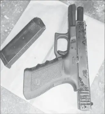  ??  ?? The unlicensed 9 mm pistol that the victims managed to take from one of the bandits