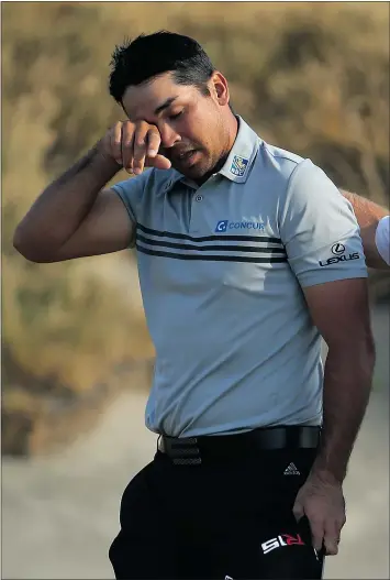  ?? — GETTY IMAGES ?? Jason Day of Australia, still feeling the effects of vertigo, walks off the 18th green after shooting a 2-under par 68 during the third round of the U.S. Open on Saturday at Chambers Bay in Washington.