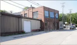  ?? Photo by Ernest A. Brown ?? These two brick buildings, located at 1158 and 1174 River St., Woonsocket, are now fully approved for a retail gun shop and shooting range as of Monday night’s Zoning Board meeting.