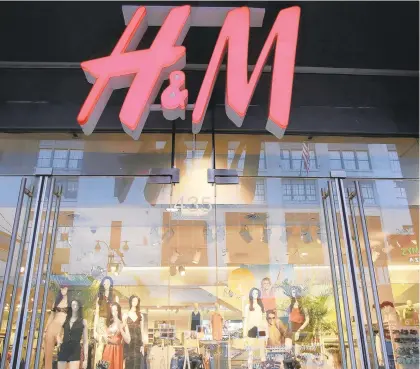  ?? MARKLENNIH­AN/AP ?? H&M, shown here in NewYork, sells fast fashion clothing.