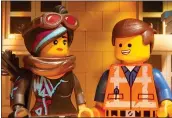  ?? WARNER BROS. PICTURES ?? Lucy (voice of Elizabeth Banks) and Emmet (Chris Pratt) face aliens in “The Lego Movie 2: The Second Part.”