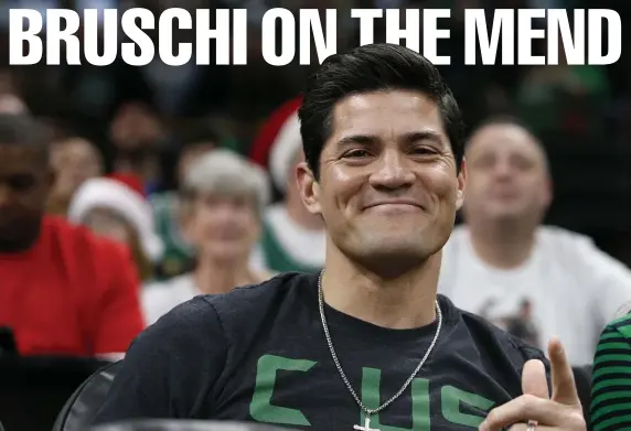  ?? BOSTON HERALD FILE ?? CHAMPIONSH­IP METTLE: Tedy Bruschi, seen at a Celtics game on Christmas Day last year and, below, celebratin­g after Super Bowl XXXVIII in February 2004, is recovering after suffering a TIA mini-stroke Thursday.