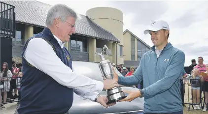  ?? Picture: Getty Images ?? ‘I WANT IT BACK’. Defending champion Jordan Spieth of the United States returns the famous Claret Jug to R&amp;A chief executive Martin Slumbers ahead of this week’s British Open at Carnoustie.