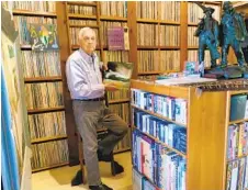  ?? SANDRA DIJKSTRA ?? Bram Dijkstra poses with some of his nearly 50,000 albums, which he is donating to San Diego State University.