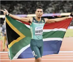  ?? EPA ?? WAYDE VAN NIEKERK celebrates after the men’s 200m final at the 2017 World Championsh­ips in London, his last race before a long injury lay-off |