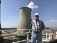  ?? DYLAN LOVAN ?? Steve Holland, general manager of the Paradise Fossil Plant, stands near one of the plant’s cooling towers in Drakesboro, Ky., on Sept. 12, 2019. Holland oversaw the Tennessee Valley Authority plant as it burned its last load of coal and shut down in February.