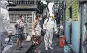  ?? THE NEW YORK TIMES ?? Workers prepare to spray disinfecta­nt in homes where people tested positive for the coronaviru­s in Bangkok in May.