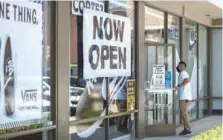  ?? (AFP) ?? A man enters a Shoe City store as Los Angeles County in Glendale recently.