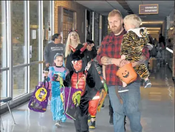  ?? Jenni Grubbs / Fort Morgan Times ?? Dragons, mermaids, tiers, superheroe­s, cats and many other creatures and people were roaming the halls at Brush High School on Halloween afternoon during the 2018 Trick or Treat Street. This year’s event will begin at 4 p.m. Friday at the Brush Secondary Campus.