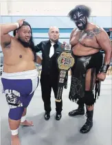  ?? SPECIAL TO METROLAND ?? Chris Snieg, with some of his big talent from Border Town Pro Wrestling. At left is Fallah Bahh and on the right is Kongo Kong.