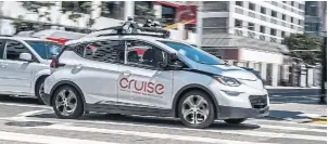  ?? TOM FOX TRIBUNE NEWS SERVICE FILE PHOTO ?? An autonomous Cruise car drives in downtown San Francisco in 2019. Microsoft joins General Motors, Honda and others in a combined new equity investment of more than $2 billion in Cruise.