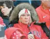  ?? ?? A Los Angeles Angels fan tries to stay warm before the team’s home opener against the Boston Red
Sox on Friday in Anaheim.