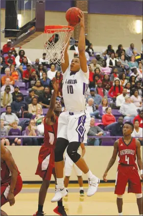  ?? Terrance Armstard/News-Times ?? Dunk in progress: El Dorado's Daniel Gafford eyes the rim before a dunk during the Wildcats' win over Texarkana last Saturday in the finals of the 6A West Conference Tournament at Wildcat Arena. Today, the Wildcats square off with Pine Bluff with a...