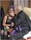  ?? JAMIE GERMANO, DEMOCRAT & CHRONICLE ?? Stephen Walbert kisses his new bride, Jennifer Walbert. He proposed after the pair were reunited after 50 years.