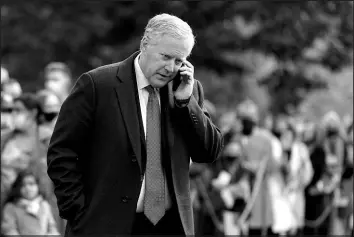  ?? PATRICK SEMANSKY / ASSOCIATED PRESS FILE (2020) ?? Then-White House chief of staff Mark Meadows speaks on a phone Oct. 30, 2020, on the South Lawn of the White House.