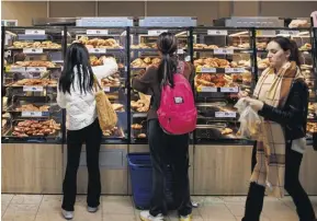  ?? PHOTOGRAPH: TOLGA AKMEN/EPA ?? The bread counter at supermarke­t Lidl: bakery product price drops have contribute­d to cooling food inflation