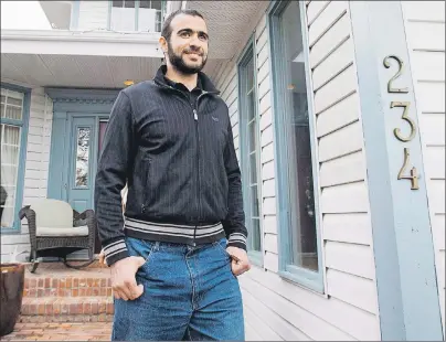  ?? CP PHOTO ?? Omar Khadr walks out the front door of his lawyer Dennis Edney’s home to speak the media in Edmonton, Alberta in a May 2015 file photo.