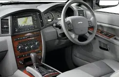  ??  ?? THAT NEW CAR SMELL. The interior shown here is not quite the same spec as Berno’s model, but the buttons in Berno’s Jeep still look brand new with no faded lettering or loose spring mechanisms.