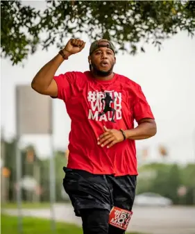  ??  ?? A JOGGER TAKES PART IN THE JUSTICE RUN FOR AHMAUD ARBERY IN LATE JUNE 2020, HELD IN BRUNSWICK