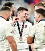  ?? ?? England's Owen Farrell (C) reacts with teammates