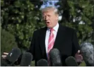  ?? MANUEL BALCE CENETA - THE ASSOCIATED PRESS ?? President Donald Trump speaks to reporters before leaving the White House, Tuesday, in Washington, for a Thanksgivi­ng trip to Mar-a-Lago estate in Palm Beach, Fla. Silent for more than a week, Trump all but endorsed embattled Alabama Republican Senate...