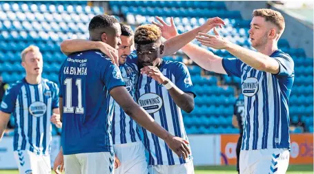  ??  ?? Kilmarnock’s Nicke Kabamba, left, celebrates his goal