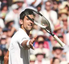  ?? AP ?? ■ Novak Djokovic drops his racquet to his chair after defeating Kevin Anderson in the final on Sunday.