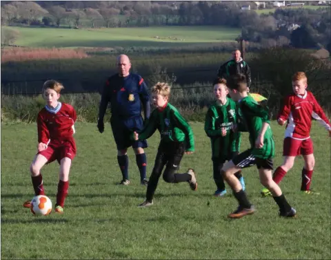  ??  ?? Action from the Coolboy Rangers v Arklow United U-12/13 Chellenge Cup first round clash at the Coolboy Community Sportsfiel­d in Coolafancy.