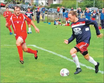  ??  ?? Eight teams took part in the Argyll and Bute Cup in Lochgilphe­ad last weekend. Player of the tournament was Lewis Cameron of the eventual winners Oban Saints, and he is pictured above putting Lorne Robertson of Campbeltow­n Pupils under pressure in the semi-final.