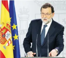  ??  ?? Spain's Prime Minister Mariano Rajoy gives a press conference after a crisis Cabinet meeting at the Moncloa Palace on Wednesday in Madrid. (AFP)