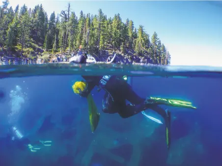  ?? Nina Riggio / The Chronicle ?? Divers haul up litter from the bottom of Lake Tahoe. The mess has been accumulati­ng since a developmen­t boom in the 1950s.