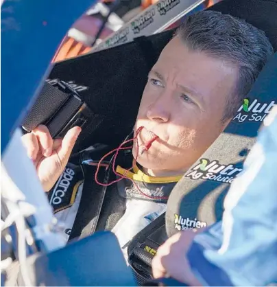  ?? JOHN RAOUX/AP ?? A J Allmending­er gets ready for the NASCAR Xfinity Series on Saturday at Daytona Internatio­nal Speedway.
