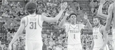  ?? Chris Covatta / Getty Images ?? Jarrett Allen, from left, Andrew Jones and Shaquille Cleare celebrate during UT’s 96-60 victory over UAB on Wednesday that coach Shaka Smart said could provide the Longhorns with a needed boost of confidence.