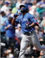  ?? The Associated Press ?? Toronto Blue Jays’ Teoscar Hernandez points skyward after hitting a solo home run against the Mariners in Seattle, Sunday.