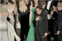  ?? ?? Robert Downey Jr. reacts as the cast and crew of ‘Oppenheime­r’ accept the award for Best Picture.