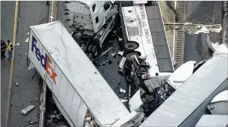  ?? KDKA TV VIA AP ?? This image from video provided by KDKA-TV shows the scene of a massive pile-up crash Jan. 5 near Greensburg, Pa., along the Pennsylvan­ia Turnpike. Multiple people were killed, including a 9-year-old girl from Dayton, and dozens were injured.