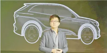  ??  ?? Singulato co-founder and CEO Shen Haiyin during the launch ceremony of an electric SUV Singulato iS6 in Beijing in April. — Reuters photo