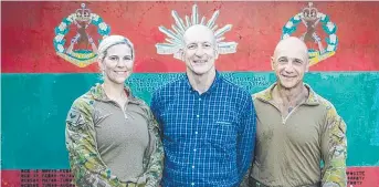  ??  ?? TEAMWORK: Deputy Commission­er Crime, Counter Terrorism and Specialist Operations Steve Gollschews­ki with Cpl Lauren Starkey and Lance-cpl Chris Buitendach from Queensland police.