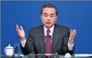  ?? FENG YONGBIN / CHINA DAILY ?? Foreign Minister Wang Yi discusses China-US ties at a news conference during the annual session of the National People’s Congress in Beijing on Wednesday.