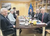  ??  ?? Theresa May with David Davis, left, and EU President Jean-Claude Juncker, second right, at a working breakfast.