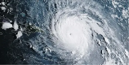  ?? NATIONAL OCEANIC AND ATMOSPHERI­C ADMINISTRA­TION HANDOUT / AGENCE FRANCE-PRESSE / GETTY IMAGES ?? A satellite image of Hurricane Irma mid-day on Wednesday as it slammed into the French Caribbean islands after making landfall in Barbuda.