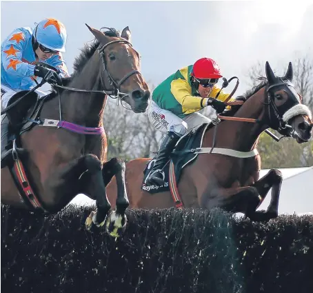  ?? Picture: Getty Images. ?? Fox Norton, right, ridden by Robbie Power, clears the last to win The Boylesport­s Champion Steeplecha­se from Un De Sceaux at Punchestow­n yesterday on the opening day of the festival. The 5-2 chance, trained by Colin Tizzard, pulled clear on the run-in...