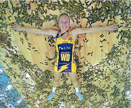  ?? GETTY IMAGES ?? Happy times: Laura Langman celebrates after helping the Lightning beat the Giants in the Super Netball Grand Final in Brisbane.