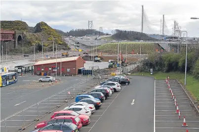  ?? Picture: Steven Brown. ?? Bridging the gap at the Ferrytoll park-and-ride site which services buses into Edinburgh and also the new Queensferr­y Crossing.