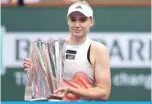  ?? ?? INDIAN WELLS: Elena Rybakina of Kazakhstan poses with the winner’s trophy after defeating Aryna Sabalenka of Belarus during the Women’s Final of the BNP Paribas Open on March 19, 2023.— AFP